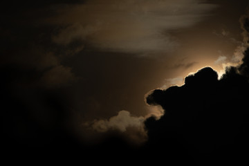 Moon light behind cloud