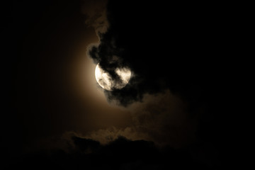 Moon light behind cloud