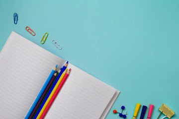 Office supplies on Blue table with copy space.Back to school concept background. Flat lay. Creative...