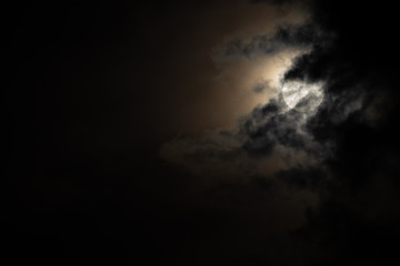 Moon light behind the cloud