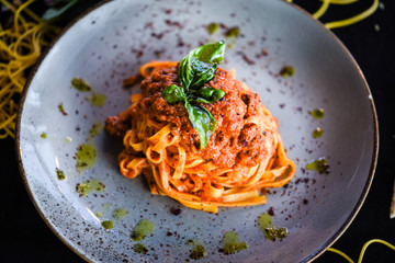 delicious italian spaghetti bolognese with minced beef sauce, tomatoes, carrots & fresh basil 