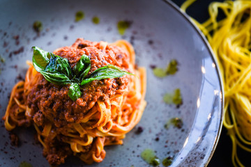 delicious italian spaghetti bolognese with minced beef sauce, tomatoes, carrots & fresh basil 