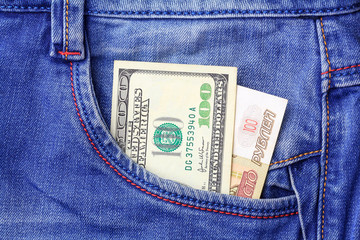 One hundred dollars and one hundred rubles in the side pocket of blue jeans
