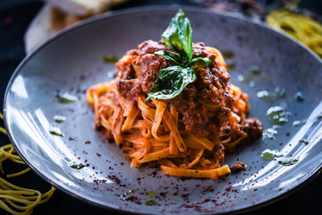 delicious italian spaghetti bolognese with minced beef sauce, tomatoes, carrots & fresh basil 