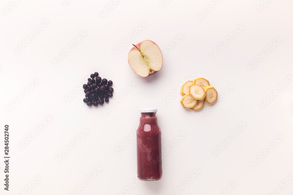 Wall mural Combination of fresh fruits in glass bottle for healthy nutrition