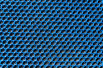Blaues Gewebe mit elastischer und gleichmäßiger Wabenstruktur und schwarzem Polsteruntergrund als...
