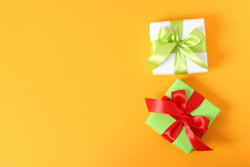 gifts on a colored background top view. Holiday, giving presents, birthday.