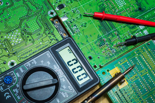 Services for the production of electronics and repair on a wooden background.