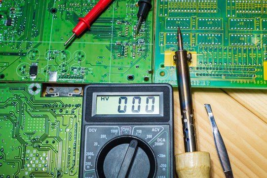 Services for the production of electronics and repair on a wooden background.