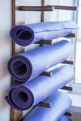 Several twisted yoga mats in the training room