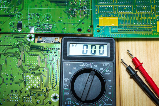 Services for the production of electronics and repair on a wooden background.