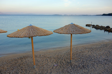 Straw umbrellas on a beach