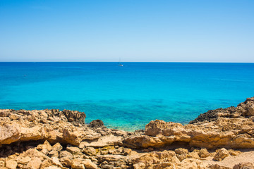 Fototapeta na wymiar colorful pristine nature of the coast of Cyprus cape cavo greco with clear blue water and yellow rocks