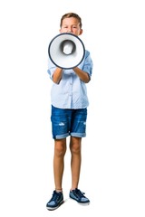 Little kid holding a megaphone on isolated white background