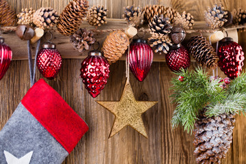 Christmas greeting card. Festive decoration on wooden background. New Year concept. Copy space.  Flat lay. Top view.