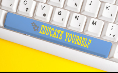 Text sign showing Educate Yourself. Business photo text prepare oneself or someone in a particular area or subject White pc keyboard with empty note paper above white background key copy space