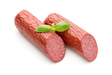 Salami smoked sausage, basil leaves on white background cutout.
