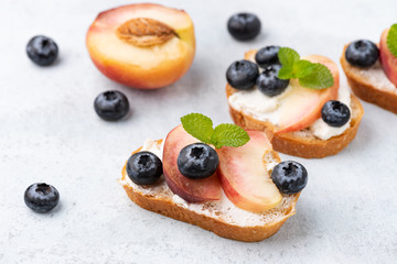 Bread toast with peach and blue berry