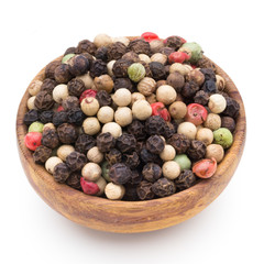 Pepper mix seed on spoon on white background.