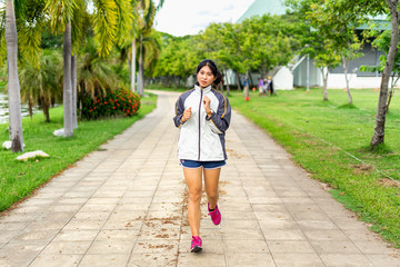Women exercising in the morning happily with running sports in the park for health is an activity that is suitable for the lifestyle of the new generation.