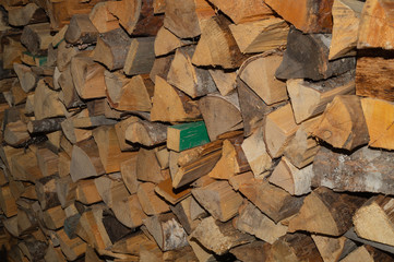 Stacks of firewood. preparation of firewood for the winter. firewood pile