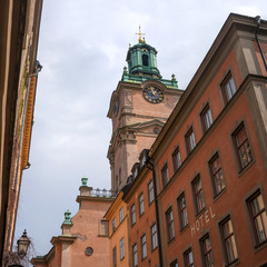 Sweden, Stockholm, on an old street in Gamlastan. The ancient part of the city. The bell tower of the church of St. Nicholas