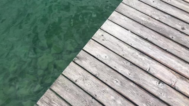Walking on wooden pier on the Achensee lake on Pertisau, Tirol, Austria