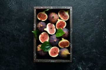 Fresh ripe figs in a wooden box. Free copy space.