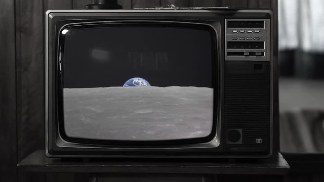 Planet Earth Raising in the Moon, as Seen on a Retro TV. Black and White Tone. Elements of this image furnished by JAXA, Japan's space agency. 