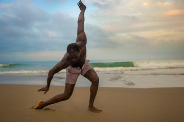 dramatic contemporary dance choreographer doing ballet beach workout, young attractive and athletic...