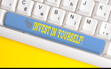 Text sign showing Invest In Yourself. Business photo text nvesting in a coach or a training to learn new things White pc keyboard with empty note paper above white background key copy space