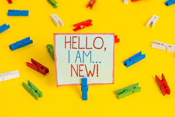 Conceptual hand writing showing Hello I Am New. Concept meaning used greeting or begin telephone conversation Colored clothespin papers empty reminder yellow floor office
