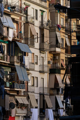 Naples old town in sunset. Traditional italian narrow alley. Naples downtown with small apartments and balconies.