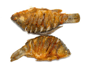 Fried fish on a plate, white background.