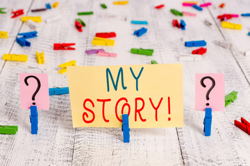 Writing note showing My Story. Business concept for your past life events actions or choices you made Crumbling sheet with paper clips placed on the wooden table