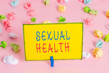 Word writing text Sexual Health. Business photo showcasing positive and respectful approach to sexual relationships Colored crumpled papers empty reminder pink floor background clothespin