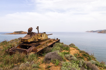Fototapeta na wymiar Abandoned old rusty tank on the dunes of Lemnos island, Greece