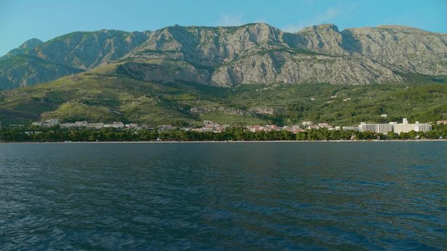 Tucepi sea shore from a boat, Biokovo mountain in the back.