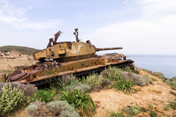 Fototapeta na wymiar Abandoned old rusty tank on the dunes of Lemnos island, Greece