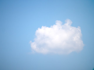 Perfect puffy white cloud on blue summer sky.