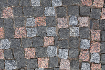 Pavement with colorful granite cobstone, background with grunge texture