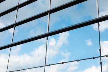 Diagonal view of glass wall of skyscraper