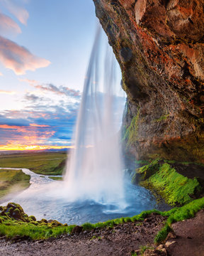 Instagram format 5x7 photo landscape in natural post-processing - Seljalandsfoss waterfall in Iceland, picturesque sunset scene. White nights summer time in Iceland. © Feel good studio