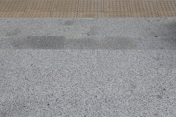 Fototapeta premium Gray granite tile with tactile paving