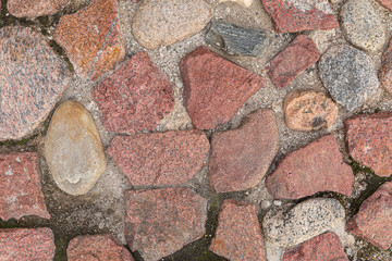 Mostly red granite stones pavement, pattern seamless, texture