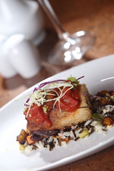 Roast pork tenderloin served on wild rice and fried plantain chips and dipped in gravy.