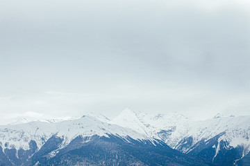 Winter panorama view of mountains. Cold winter maille cloudy day in mountains