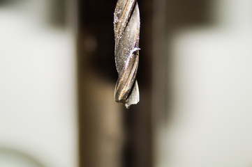 Drill bit of a drilling machine close up. working tool