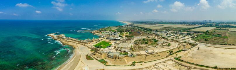 Fototapeta na wymiar Aerial view of the ruins of the Roman Amphitheater in the sand dunes of the ancient city of Caesarea Maritima built by Herod the Great 