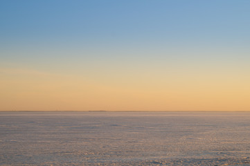 Fototapeta na wymiar Frozen lake at evening landscape background. horizon line